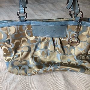 Coach woman’s tan and blue purse